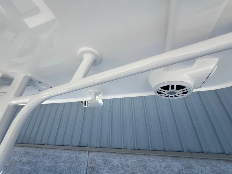Slide: The Image of 2025 NauticStar 252L boat underside with speaker and rod holder. - 45