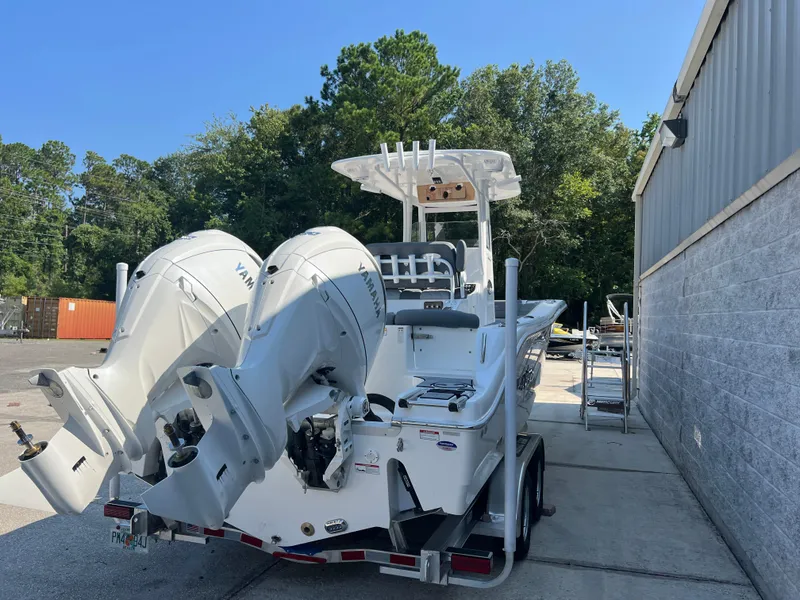 Slide: The Image of 2025 NauticStar 252L boat with dual Yamaha engines on a trailer. - 6