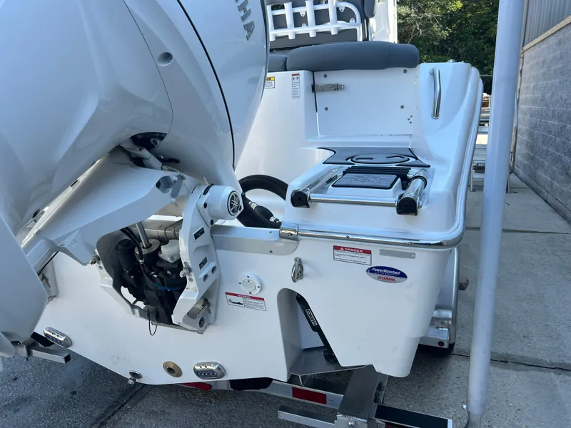 Slide: The Image of 2025 NauticStar 252L boat with Yamaha outboard motor, rear view. - 7