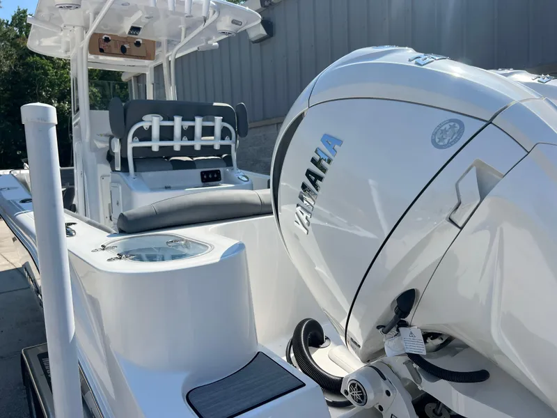 Slide: The Image of 2025 NauticStar 252L boat with Yamaha engine, sleek design, and modern features. - 8