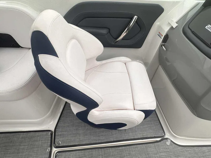 Slide: The Image of 2019 Chaparral 244 Sunesta boat seat with white and navy upholstery. - 20
