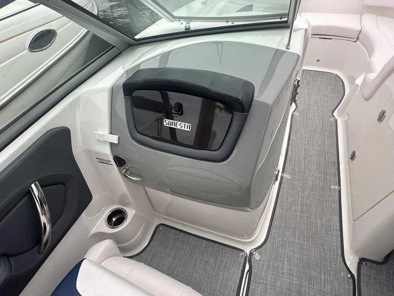 Slide: The Image of 2019 Chaparral 244 Sunesta boat interior with sleek seating and modern design. - 21