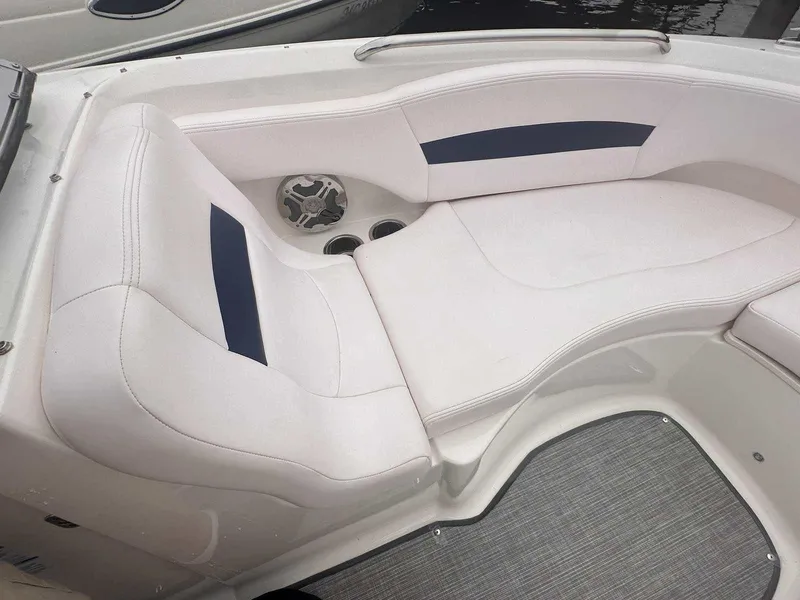 Slide: The Image of 2019 Chaparral 244 Sunesta boat interior with white seating and blue accents. - 29