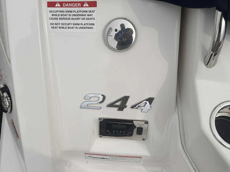 Slide: The Image of 2019 Chaparral 244 Sunesta boat detail with safety warning and model number. - 4