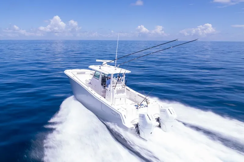 Slide: The Image of 2024 Caymas 34 CT boat cruising on open ocean waters. - 10