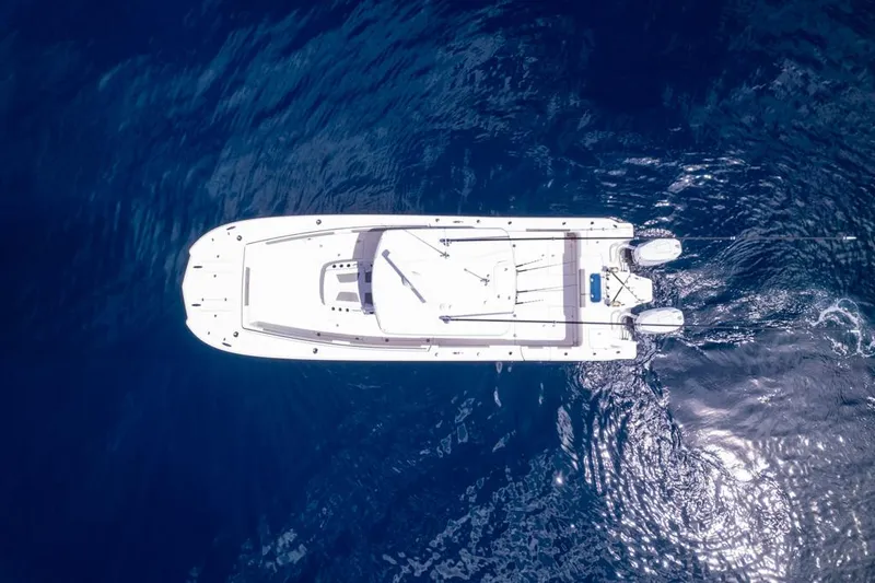 Slide: The Image of Aerial view of 2024 Caymas 34 CT boat on deep blue ocean water. - 12
