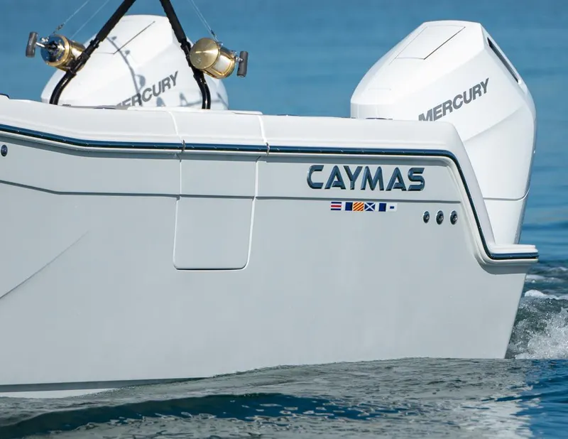 Slide: The Image of 2024 Caymas 34 CT boat with Mercury engines on water. - 14