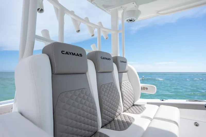 Slide: The Image of 2024 Caymas 34 CT boat seats with ocean view, featuring luxurious quilted design. - 15