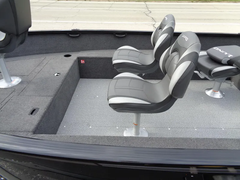 Slide: The Image of 2025 Lund 1650 Rebel XL Tiller boat interior with two gray seats. - 5