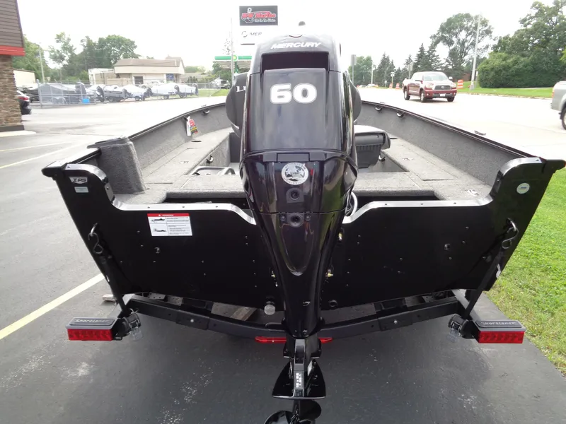 Slide: The Image of 2025 Lund 1650 Rebel XL Tiller boat with Mercury 60 engine, rear view. - 8