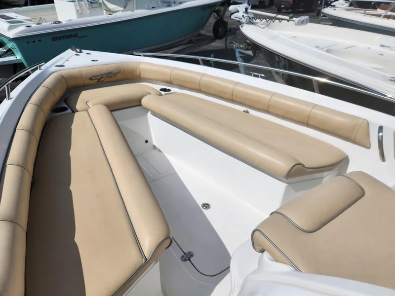 Slide: The Image of 2018 Glasstream 255 Pro-XS boat with beige seating, docked in marina. - 11