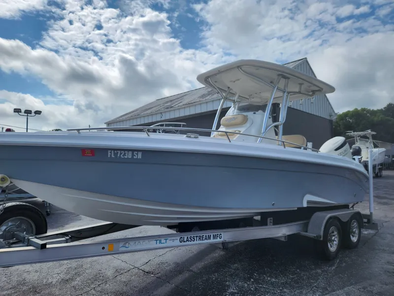 Slide: The Image of 2018 Glasstream 255 Pro-XS boat on trailer under cloudy sky. - 14