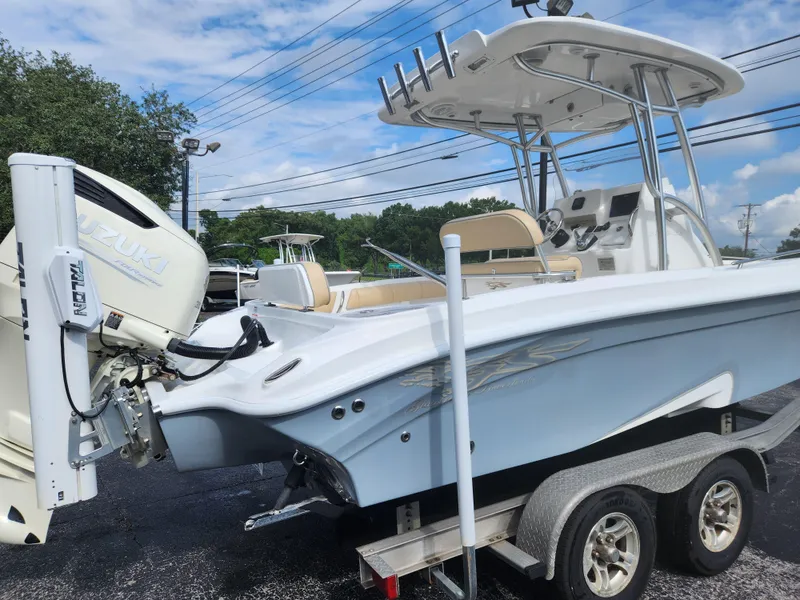 Slide: The Image of 2018 Glasstream 255 Pro-XS boat on trailer, featuring sleek design and powerful engine. - 2