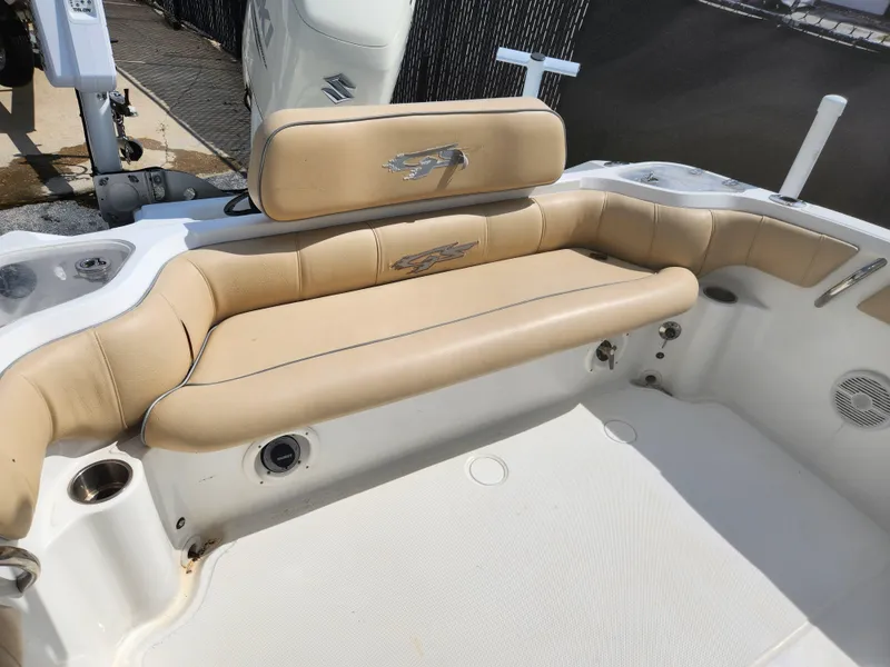 Slide: The Image of 2018 Glasstream 255 Pro-XS boat interior with beige seating and cup holders. - 4