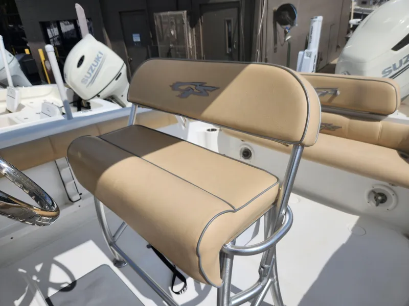 Slide: The Image of 2018 Glasstream 255 Pro-XS boat with tan seating and Suzuki outboard motors. - 6