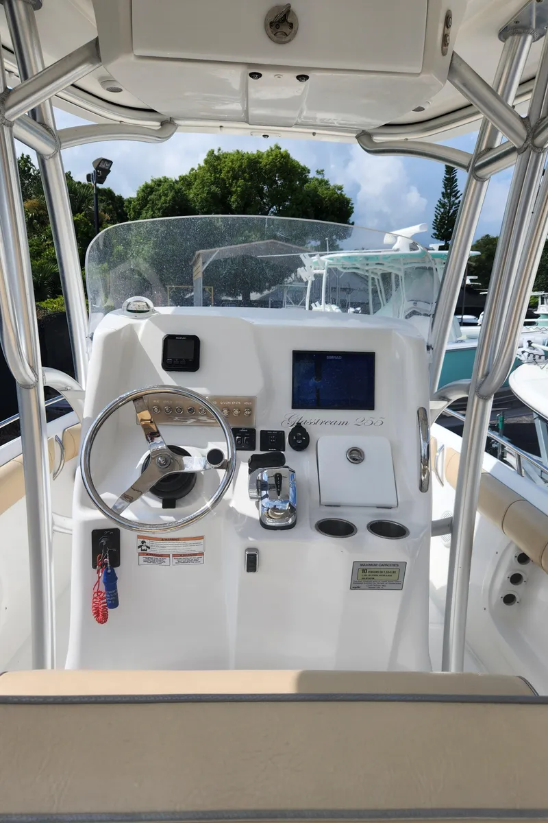 Slide: The Image of 2018 Glasstream 255 Pro-XS boat console with steering wheel and navigation equipment. - 8
