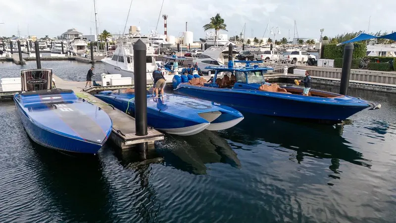 Slide: The Image of Boats docked at a marina, featuring a 2013 Skater 46 model. - 7