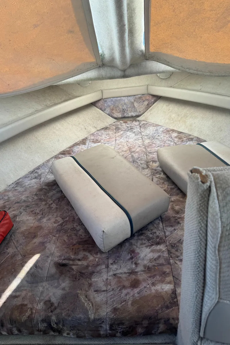 Slide: The Image of Interior cabin of 1996 Bayliner 2452 Ciera Express Hardtop with cushioned seating. - 17