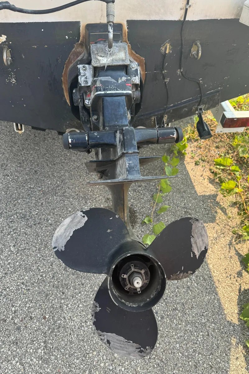 Slide: The Image of Propeller of 1996 Bayliner 2452 Ciera Express Hardtop on pavement background. - 21