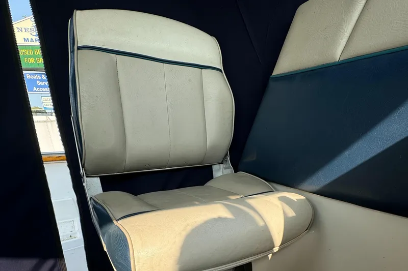 Slide: The Image of 1996 Bayliner 2452 Ciera Express Hardtop interior seat, beige upholstery, close-up view. - 9
