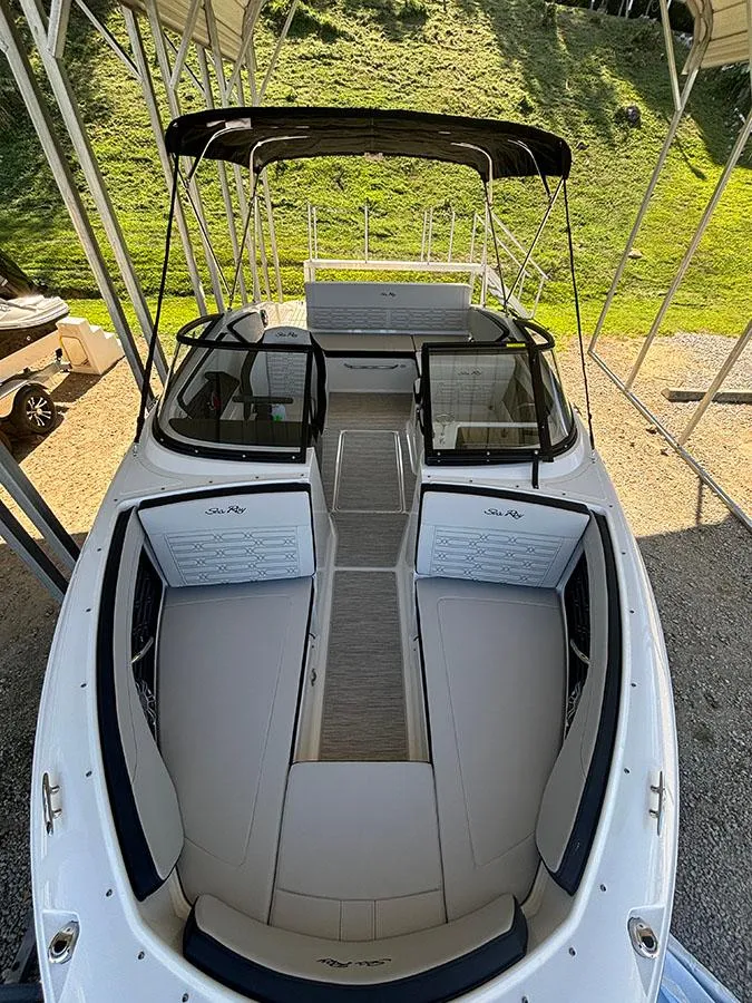 Slide: The Image of 2025 Sea Ray SPX 210 boat with spacious seating and sleek design. - 2