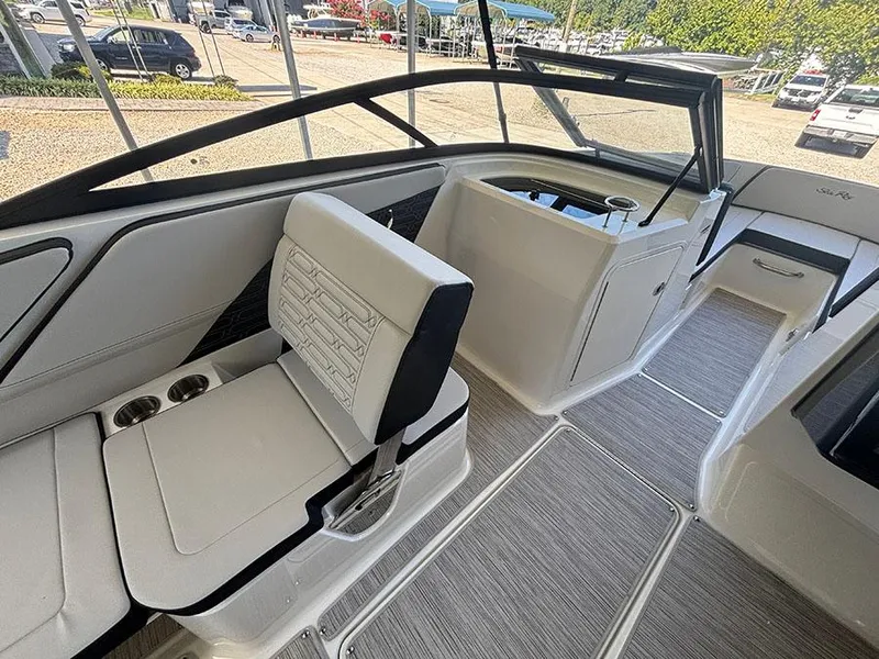 Slide: The Image of 2025 Sea Ray SPX 210 boat interior with sleek seating and modern design. - 8