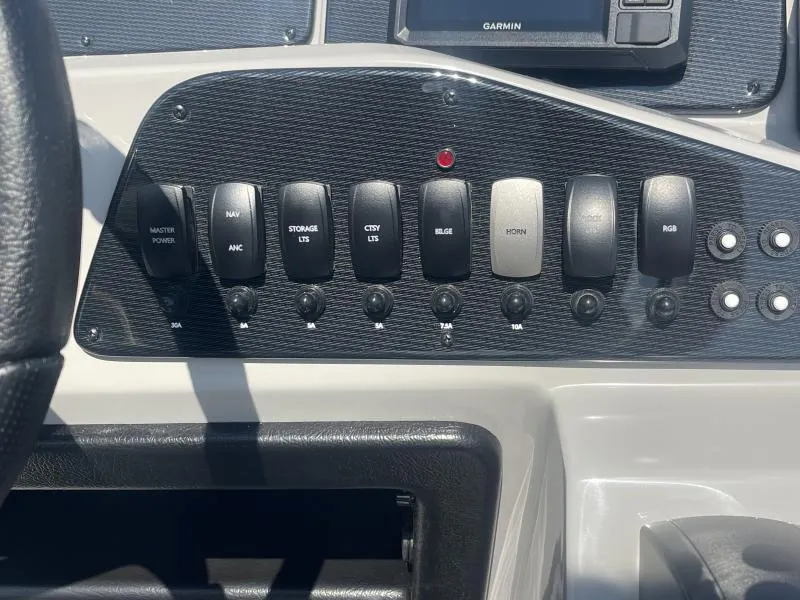 Slide: The Image of Control panel of 2025 G3 SunCatcher V322 RC boat with labeled switches. - 15