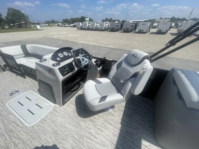 Slide: The Image of 2025 G3 SunCatcher V322 RC boat interior with steering console and seating. - 17