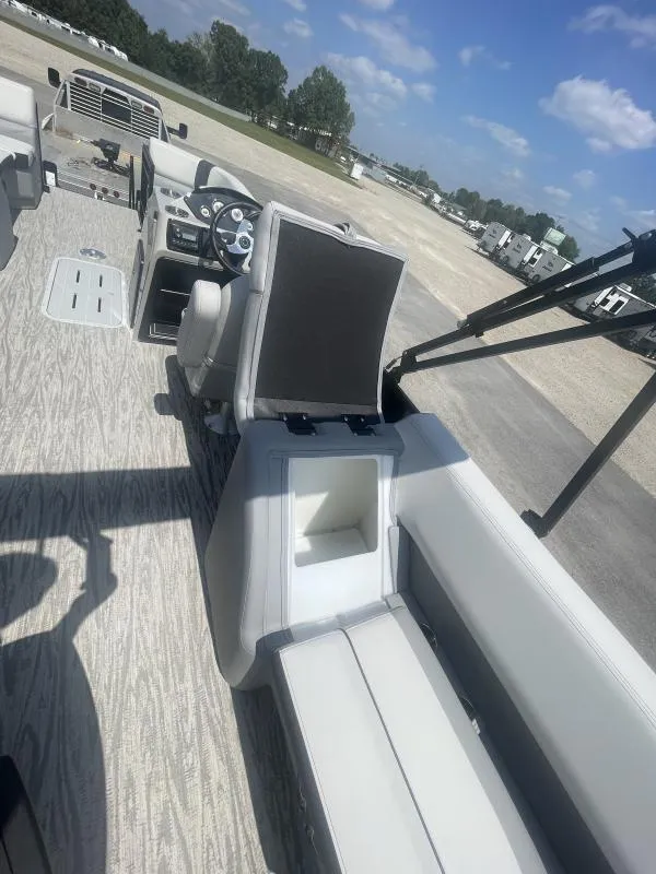 Slide: The Image of 2025 G3 SunCatcher V322 RC pontoon boat interior with open storage compartment. - 18
