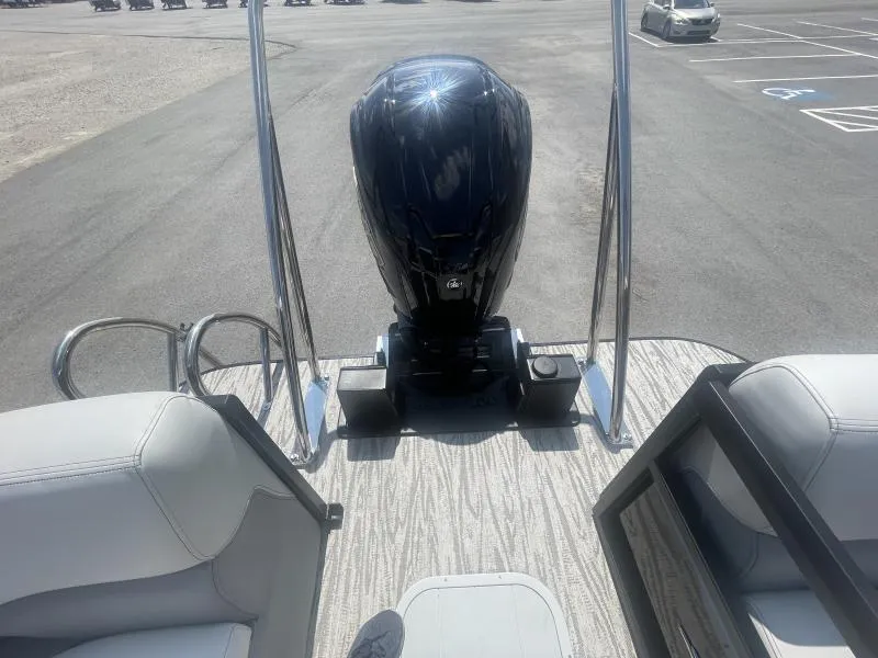 Slide: The Image of 2025 G3 SunCatcher V322 RC boat with outboard motor in parking lot. - 19
