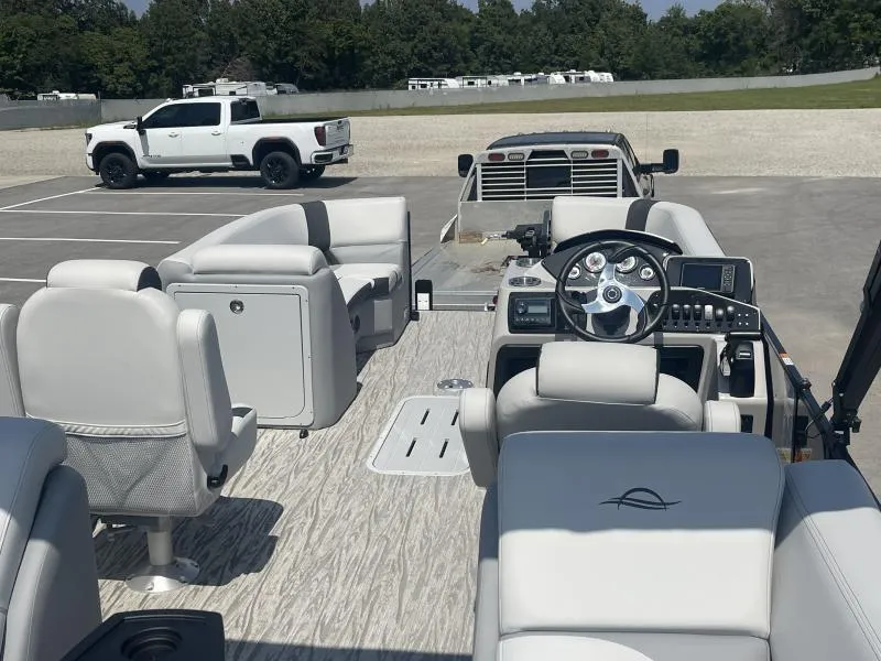 Slide: The Image of 2025 G3 SunCatcher V322 RC pontoon boat interior with modern seating and steering console. - 4