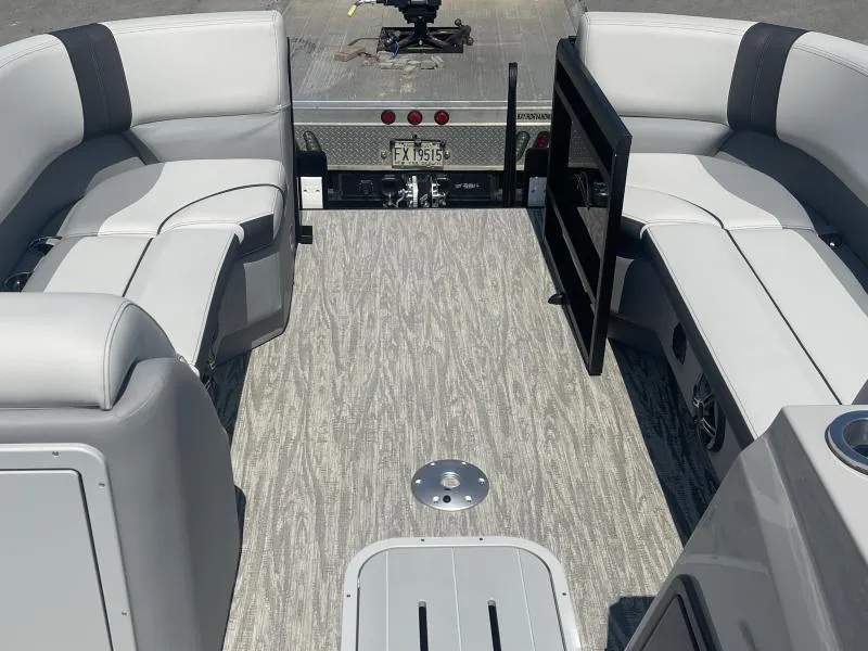 Slide: The Image of 2025 G3 SunCatcher V322 RC boat interior with gray seating and flooring. - 5