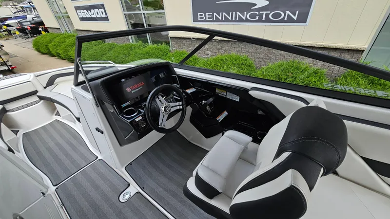 Slide: The Image of 2019 Yamaha Boats 242 LIMITED S E SERIES interior with sleek dashboard and comfortable seating. - 13