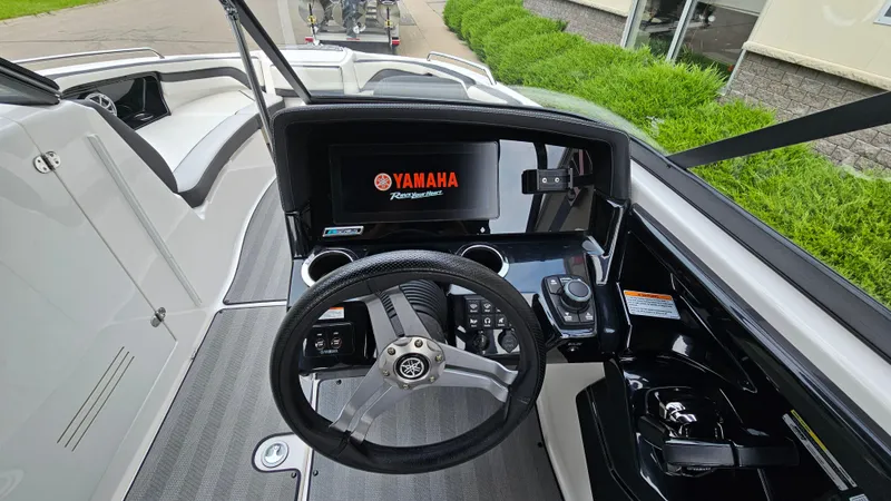 Slide: The Image of 2019 Yamaha Boats 242 LIMITED S E SERIES dashboard with steering wheel and display screen. - 14