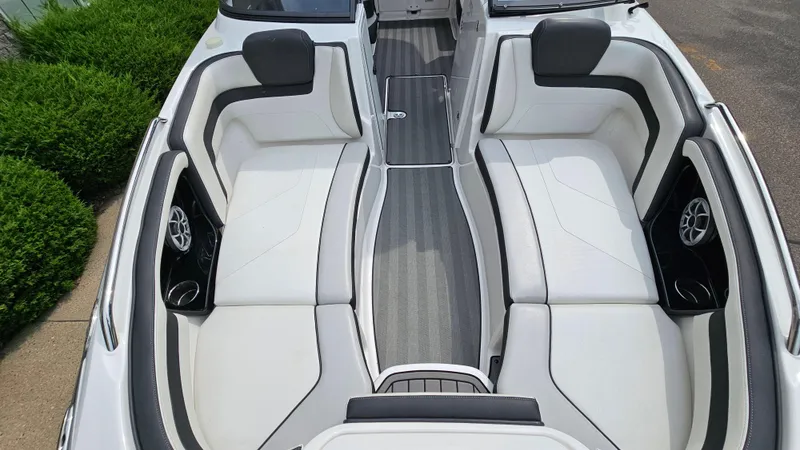 Slide: The Image of 2019 Yamaha Boats 242 LIMITED S E SERIES interior with sleek white seating and modern design. - 18