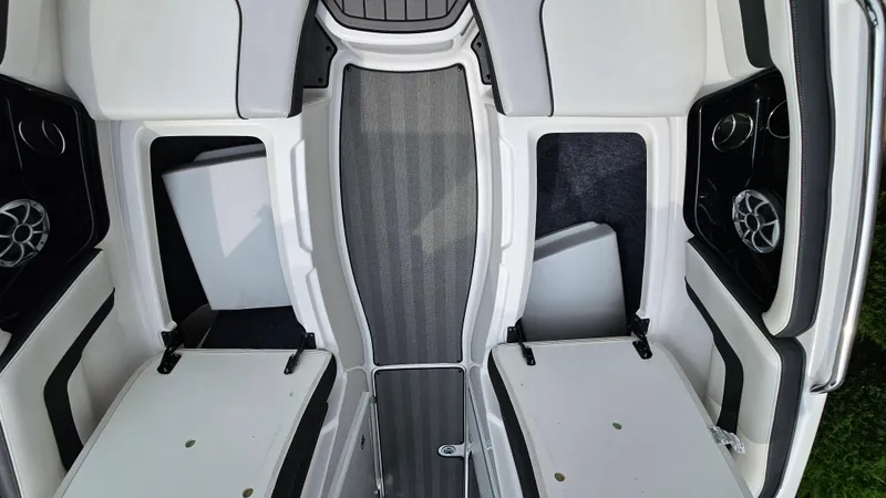 Slide: The Image of 2019 Yamaha Boats 242 LIMITED S E SERIES interior with open storage compartments. - 23