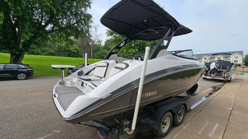 Slide: The Image of 2019 Yamaha Boats 242 LIMITED S E SERIES on trailer, parked outdoors. - 3