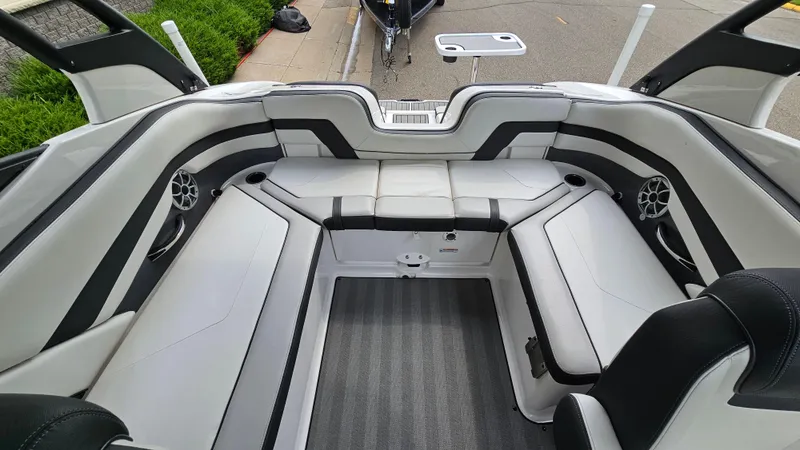 Slide: The Image of 2019 Yamaha Boats 242 LIMITED S E SERIES interior with sleek seating and modern design. - 8