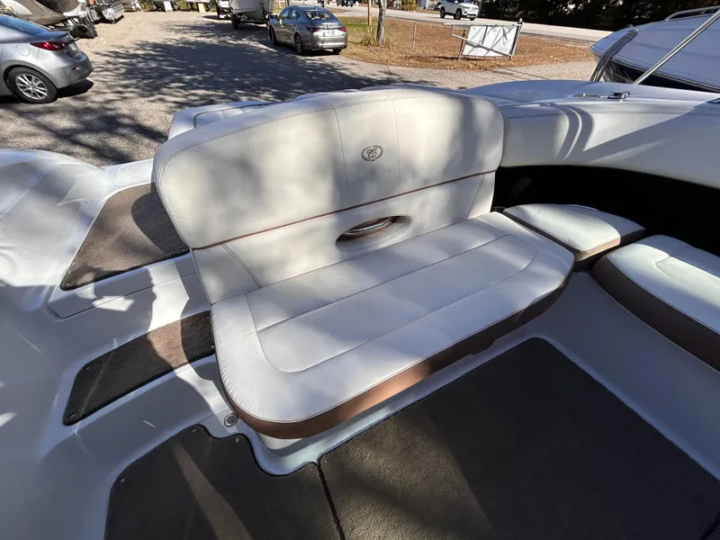 Slide: The Image of 2012 Cobalt 232 Bowrider boat interior with cushioned seating. - 10