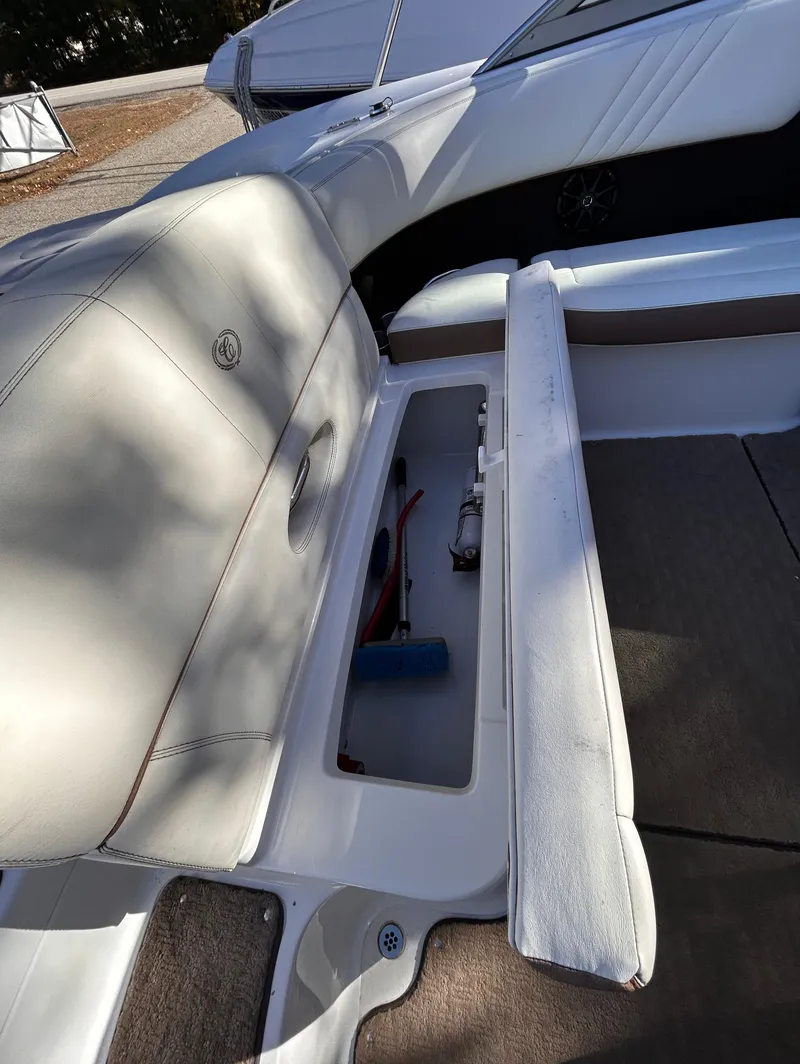 Slide: The Image of 2012 Cobalt 232 Bowrider interior with open storage compartment. - 11