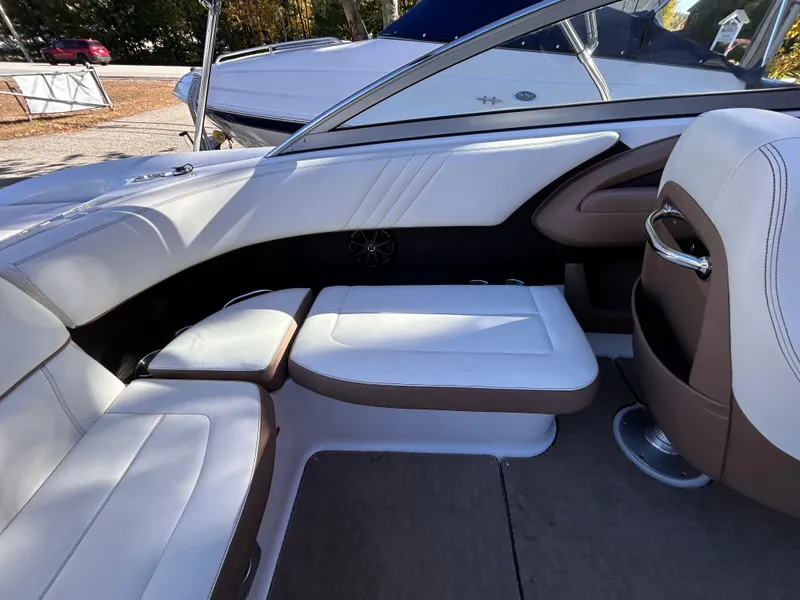 Slide: The Image of 2012 Cobalt 232 Bowrider interior with white and brown seating. - 12