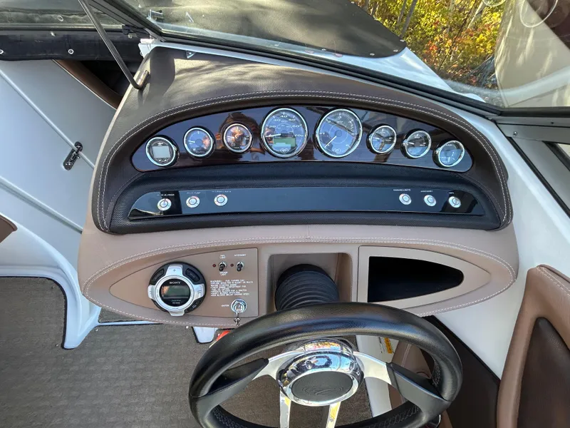 Slide: The Image of 2012 Cobalt 232 Bowrider dashboard with gauges and steering wheel. - 18