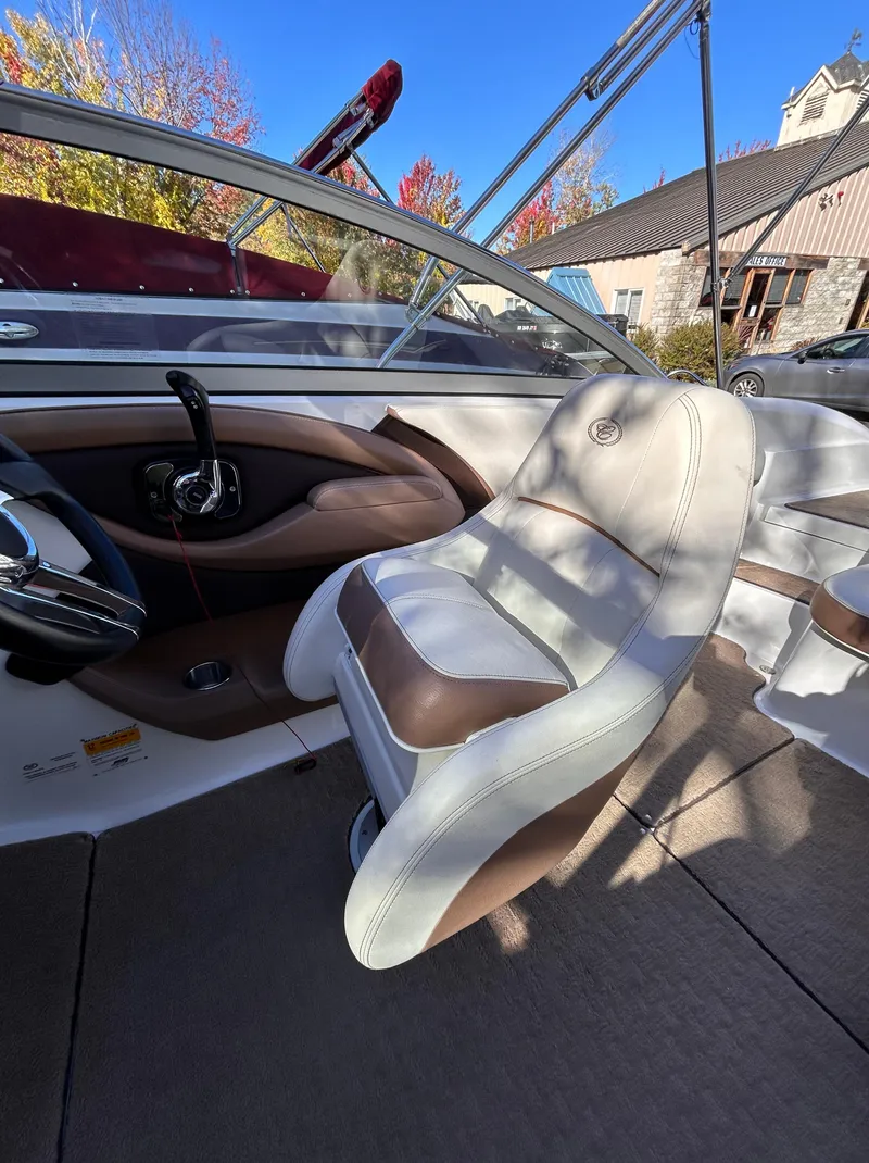 Slide: The Image of 2012 Cobalt 232 Bowrider interior with steering wheel and seating. - 20