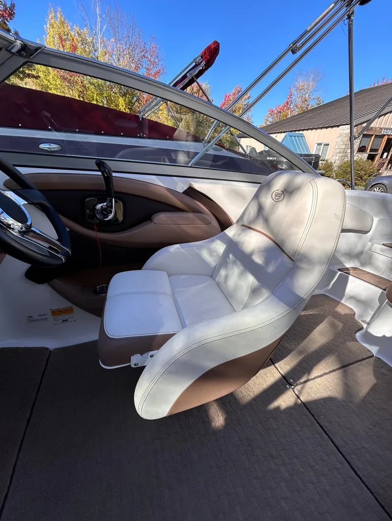 Slide: The Image of 2012 Cobalt 232 Bowrider interior with steering wheel and seating. - 21