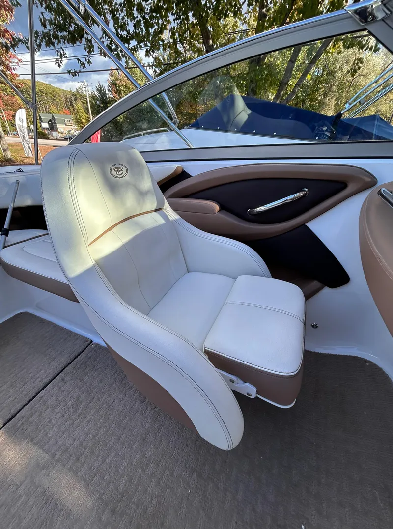 Slide: The Image of Interior of 2012 Cobalt 232 Bowrider boat with white and brown seating. - 28