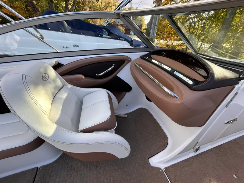 Slide: The Image of Interior of 2012 Cobalt 232 Bowrider boat with beige and brown seating. - 30