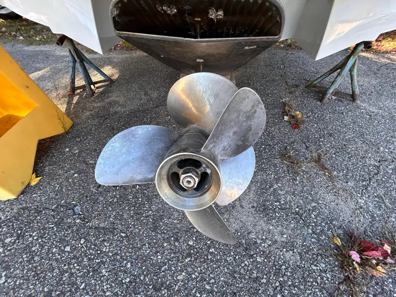 Slide: The Image of Propeller of 2012 Cobalt 232 Bowrider on pavement, supported by stands. - 43