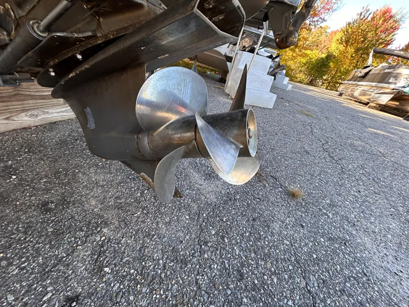 Slide: The Image of Close-up of 2012 Cobalt 232 Bowrider boat propeller on asphalt surface. - 44