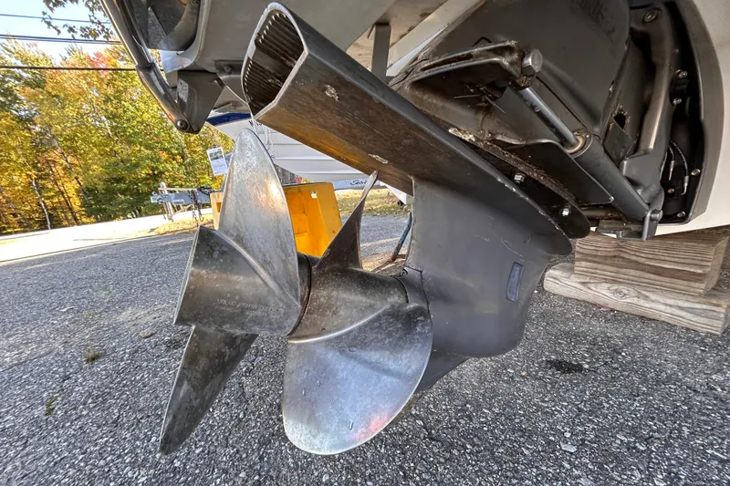 Slide: The Image of Close-up of 2012 Cobalt 232 Bowrider boat propeller on asphalt surface. - 45