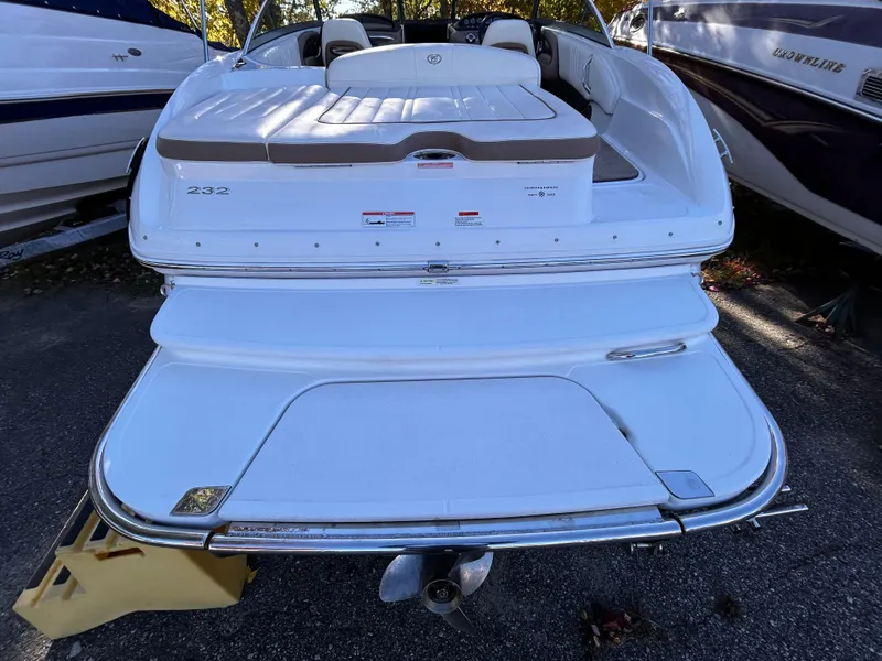 Slide: The Image of 2012 Cobalt 232 Bowrider boat, rear view with swim platform. - 6